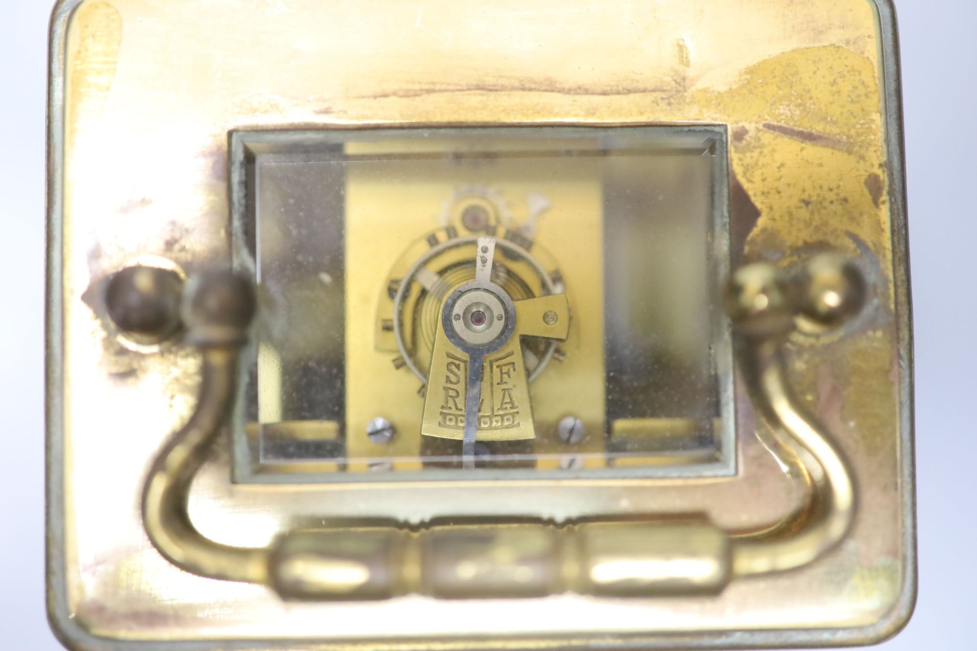 A late 19th century French brass cased eight day carriage timepiece with incorporated alarm, height 12cm